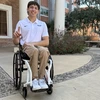 A man in a wheelchair poses for a photo.